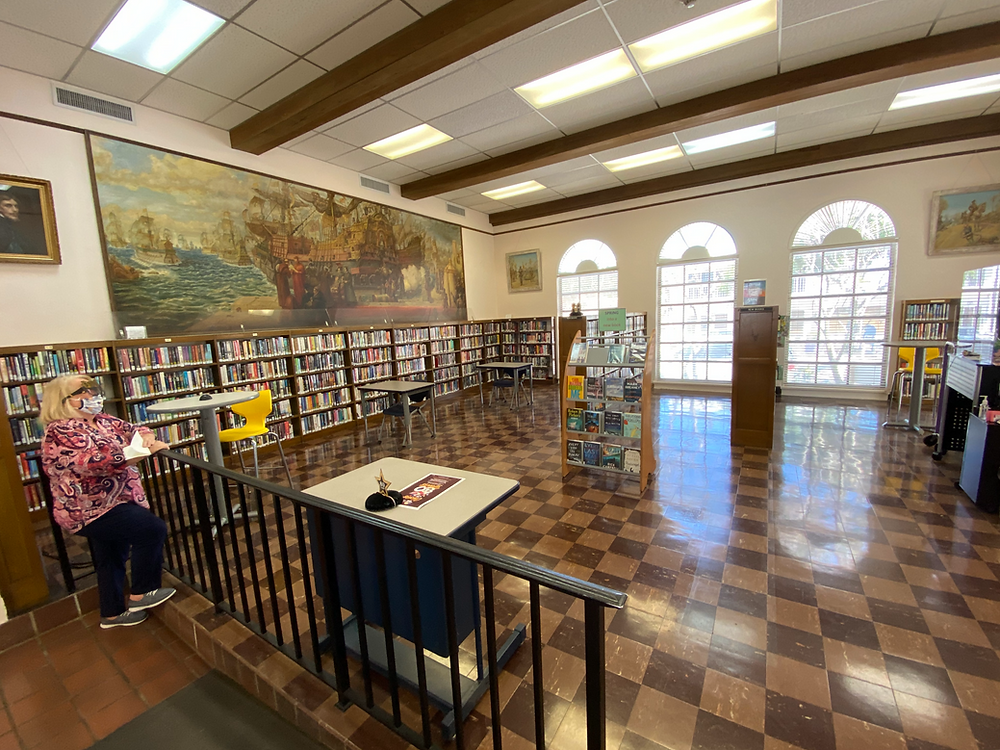 Community members enjoying library programs and reading together